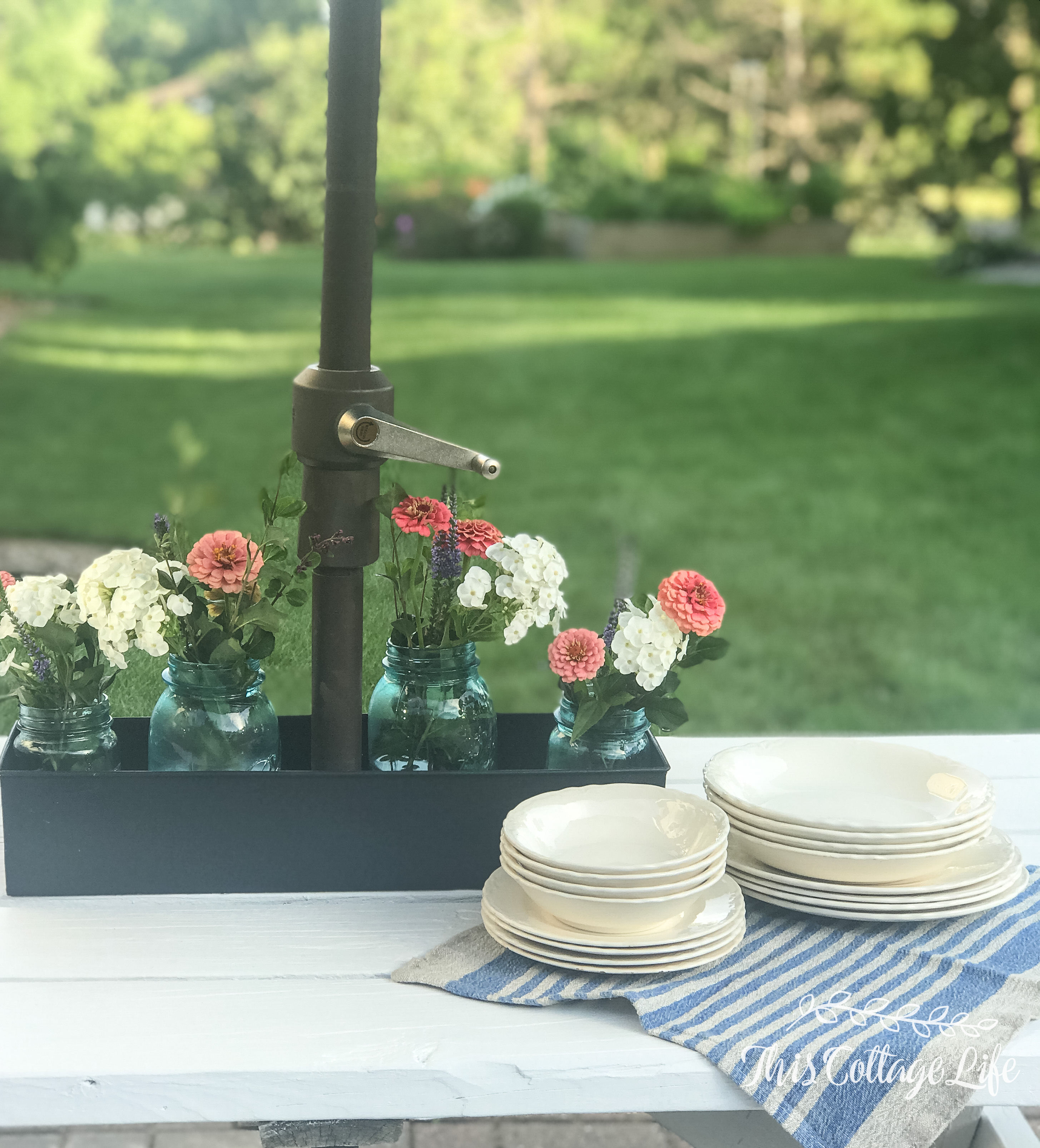 Adding A Centerpiece To A Patio Table With Umbrella This Cottage Life